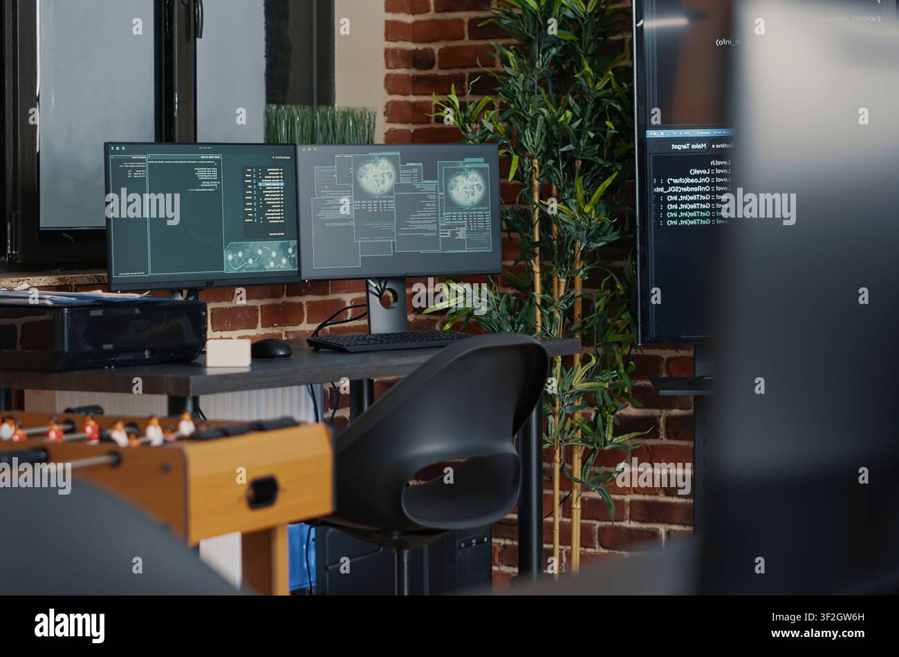 Desk with multiple computer monitors displaying neural network visualisation and artificial intelligence parsing code with multiple monitors, programming code and cloud computing visuals inside an. Stock Photo