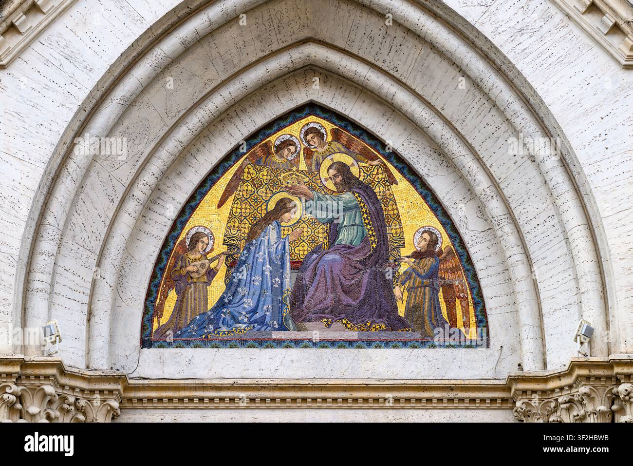 The Coronation of the Virgin Mary – mosaic on the pediment of Santa Maria del Rosario Church in Rome, Italy. Stock Photo