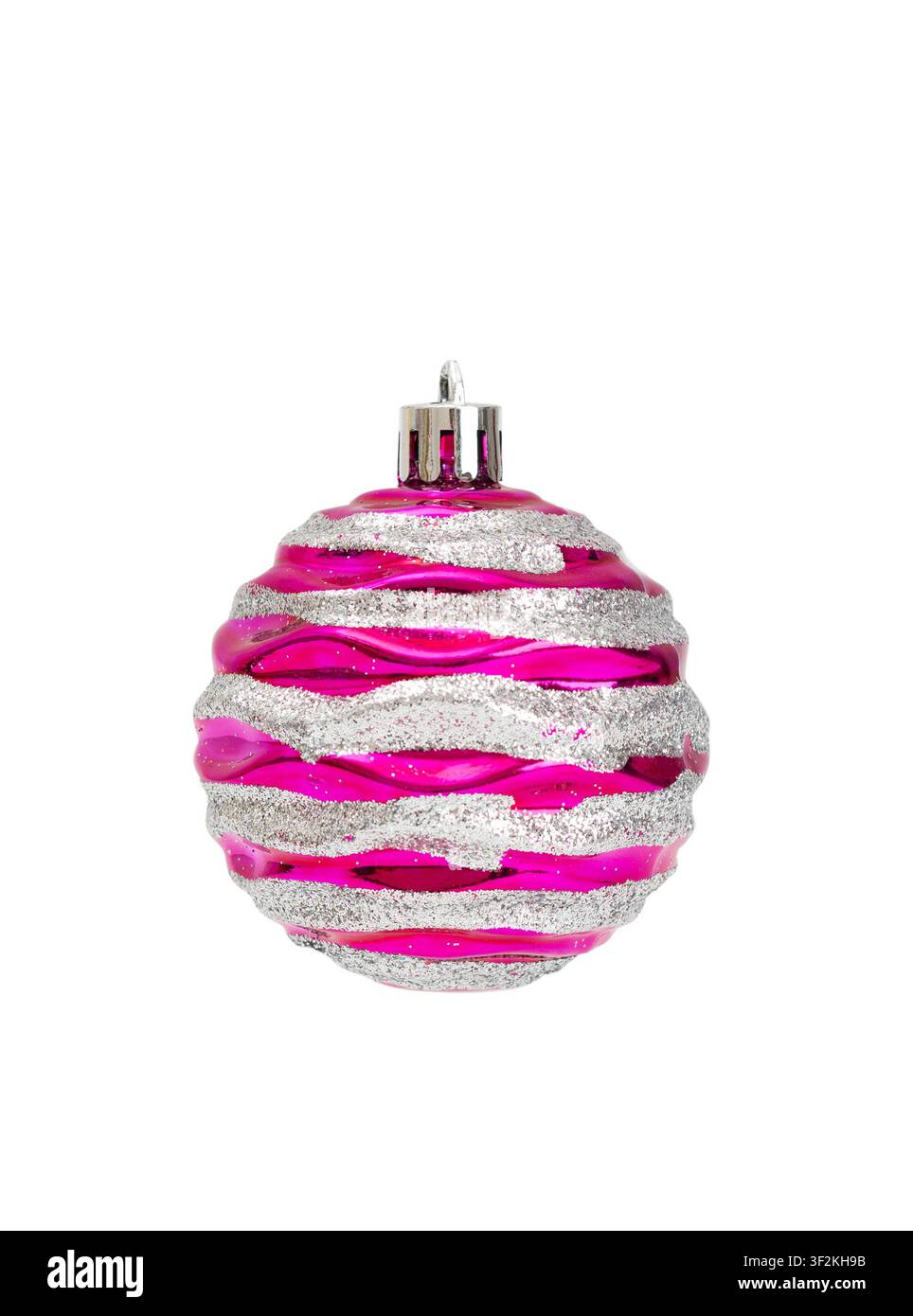 Vibrant magenta pink glass Christmas bauble with sparkly silver glitter striped waves on white Stock Photo