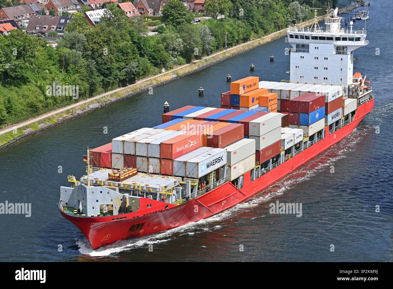 Containership BF CARP passing the Kiel canal Stock Photo