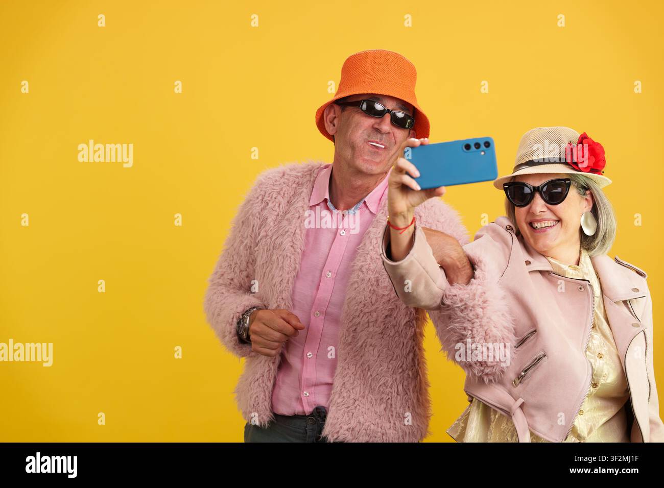 Mature couple taking selfie celebrating active aging Stock Photo