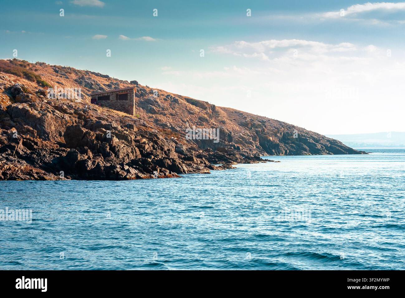 sea coast of bulgaria. travel background for summer vacations in europe. rock shore of st. peter island in evening light Stock Photo
