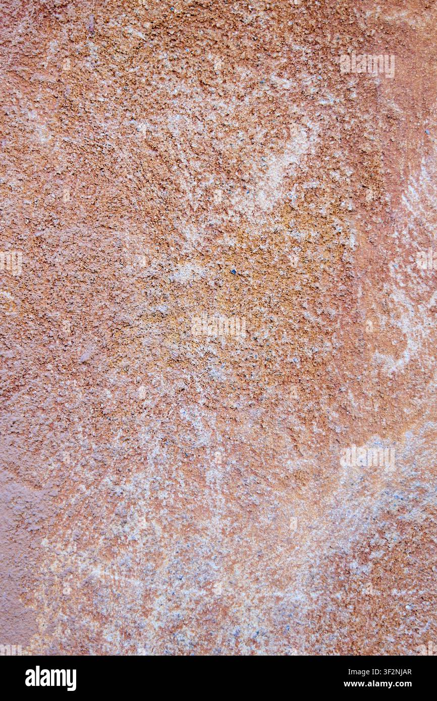 Rustic Terracotta Stucco Wall Texture Background with Weathered Rough Plaster Surface. Stock Photo
