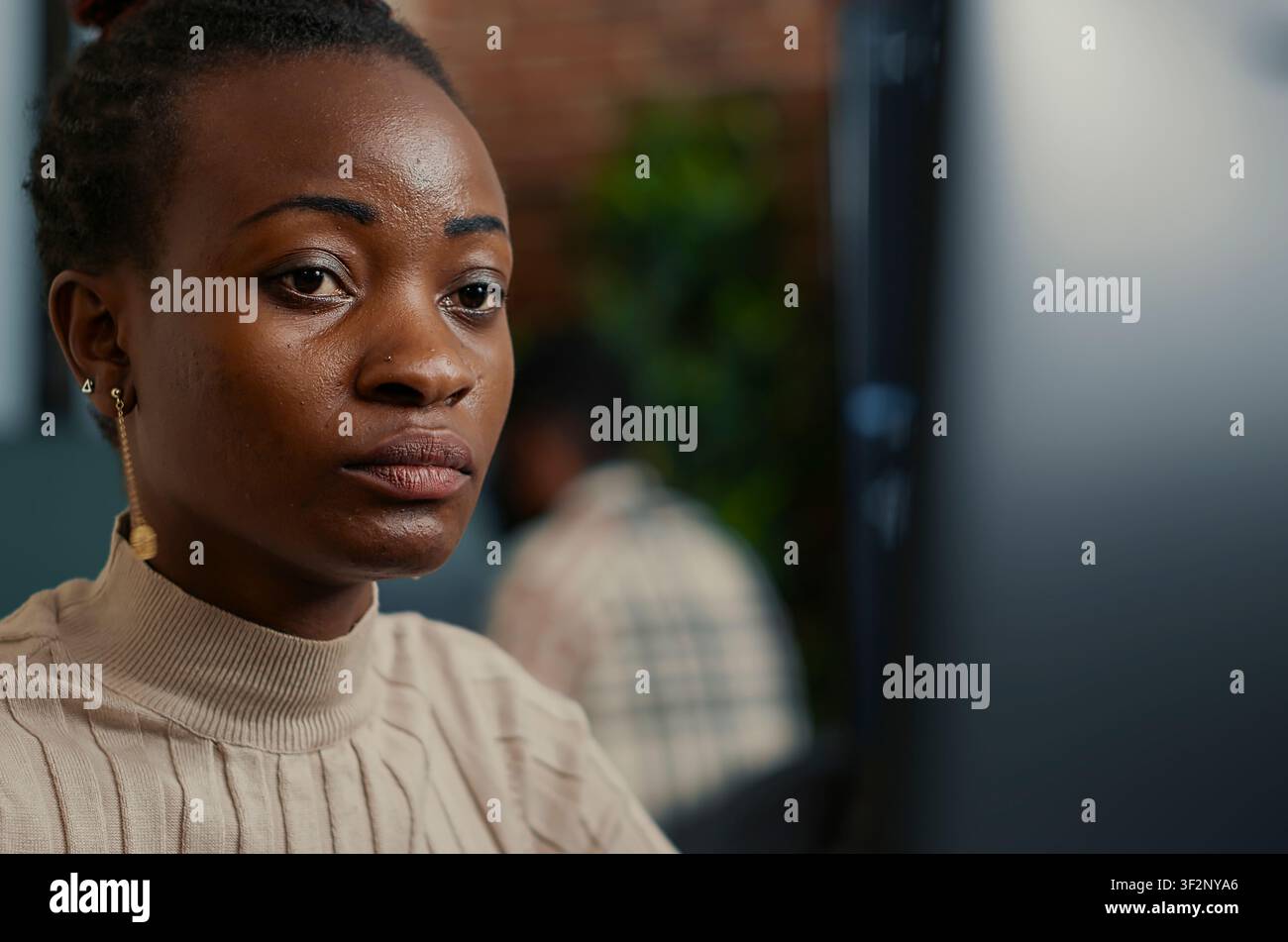 Black Programmer Smiling While Coding at Computer at a software development desk after compiling source code successfully, showing algorithm work and coding success. Stock Photo