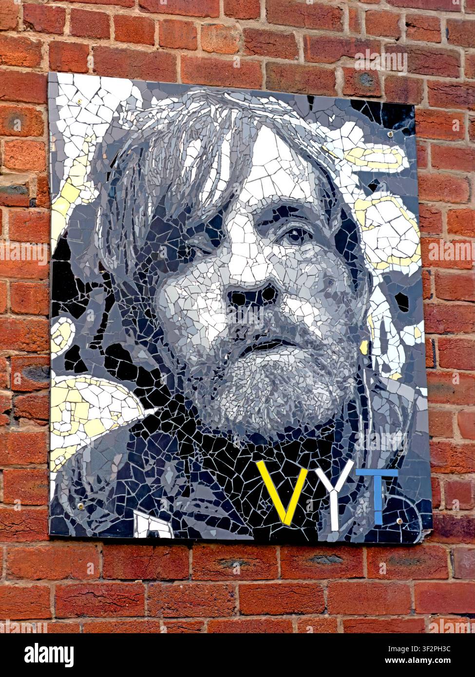 Mosaic memorial portrait of Leeds character Terry “Pudsey Macca” McCann, displayed in the yard of the Angel Inn in Leeds city centre Stock Photo