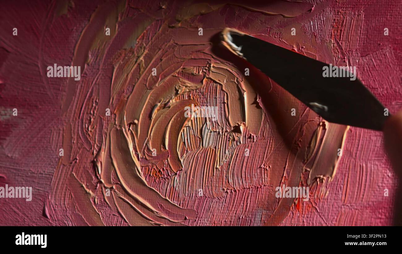Pink paint spread with palette knife on textured surface Stock Photo