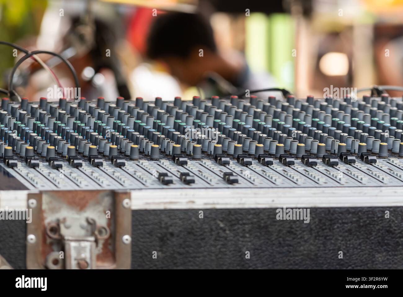 Professional audio mixing console with multiple channel controls for live sound production recording broadcasting and music performance technology Stock Photo
