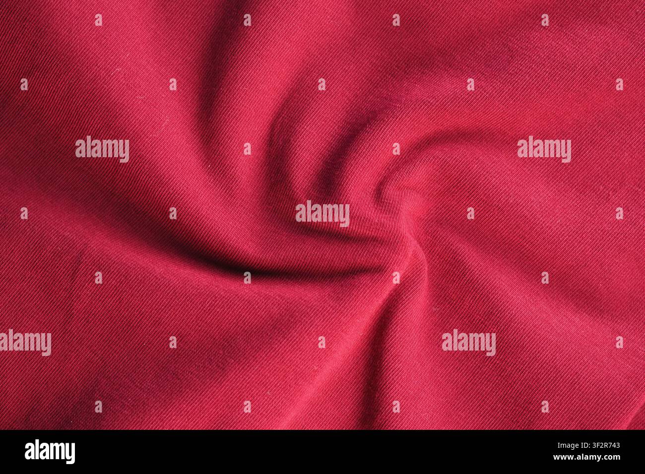 Red fabric shows spiral texture and soft feel Stock Photo