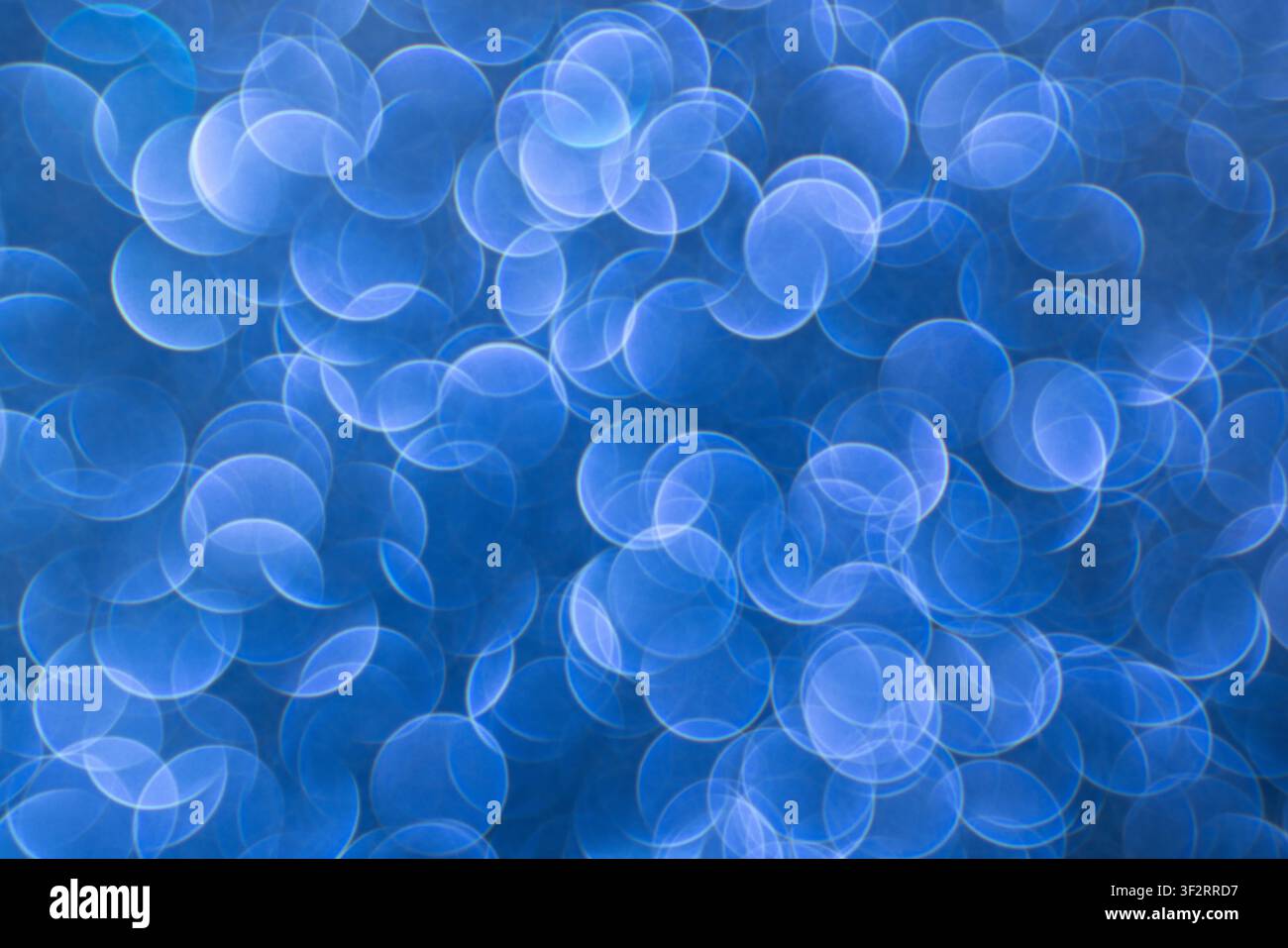 Soft blue bokeh on an abstract background for digital design, event screens and modern visuals Stock Photo