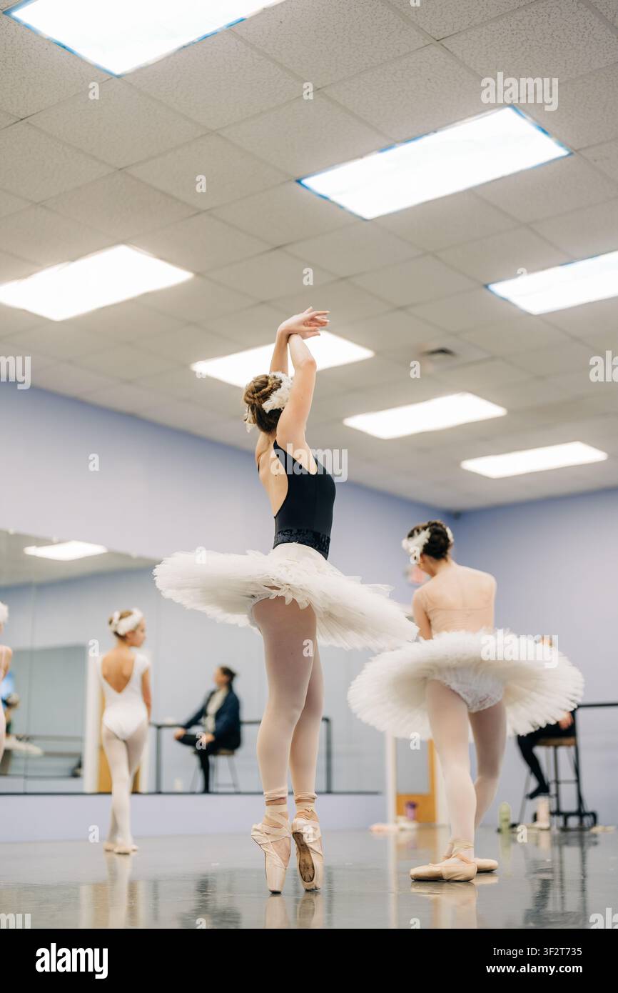 Young ballerinas rehearsing on pointe in ballet dance studio Stock Photo