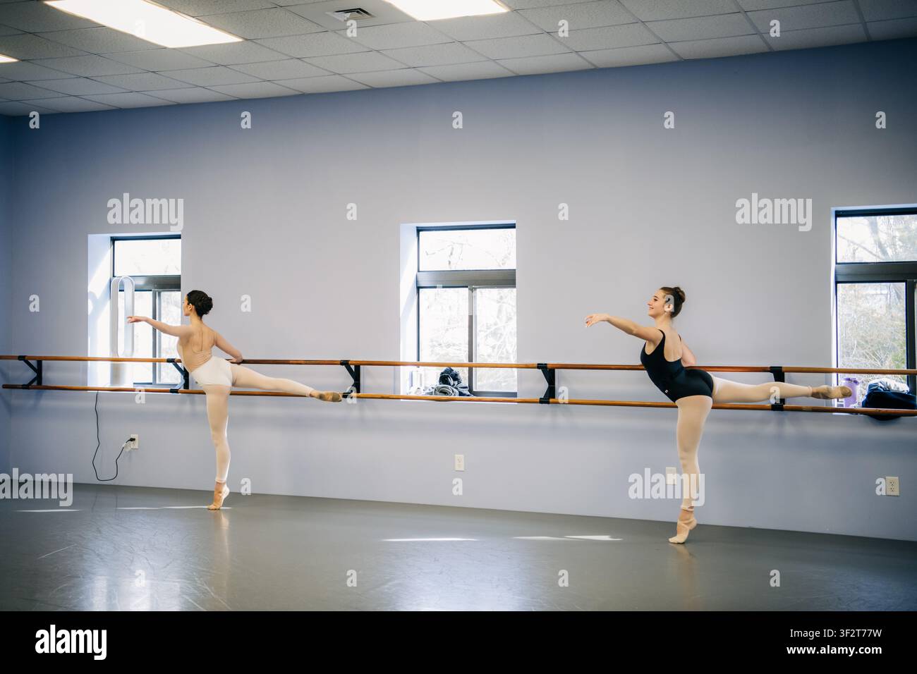 Ballerinas training at dance studio barre Stock Photo