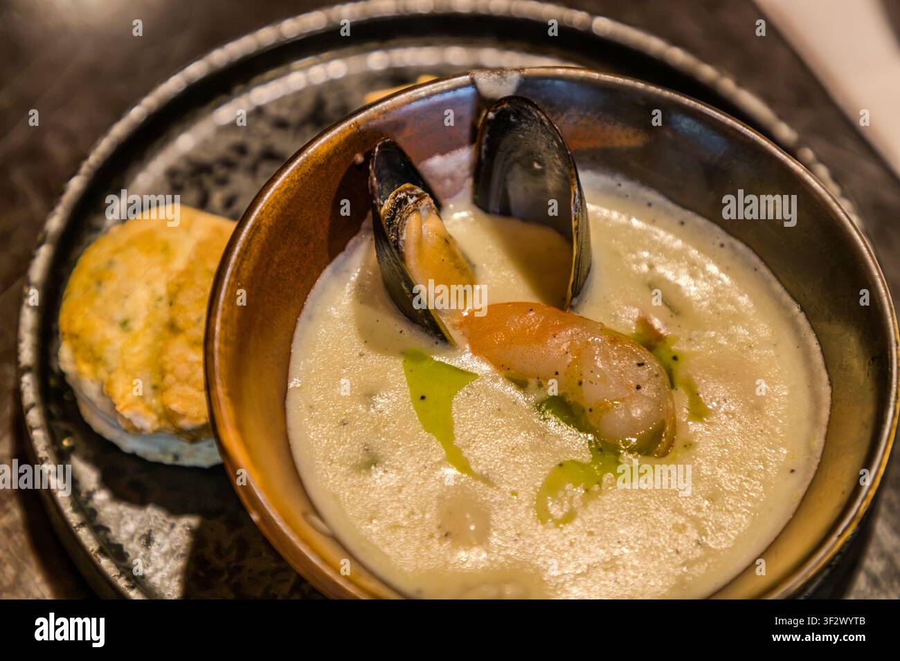 Seafood chowder (a creamy soup with mussels and prawns) is served at the restaurant of the Halifax Marriott Harbourfront Hotel on Upper Water Street, Halifax, Canada Stock Photo