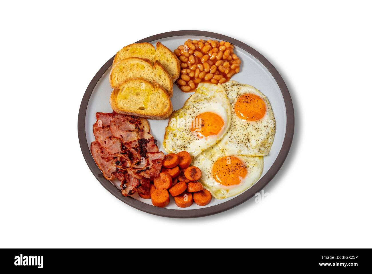 Full English Breakfast with Fried Eggs, Bacon, Sausages, Baked Beans and Toast Stock Photo