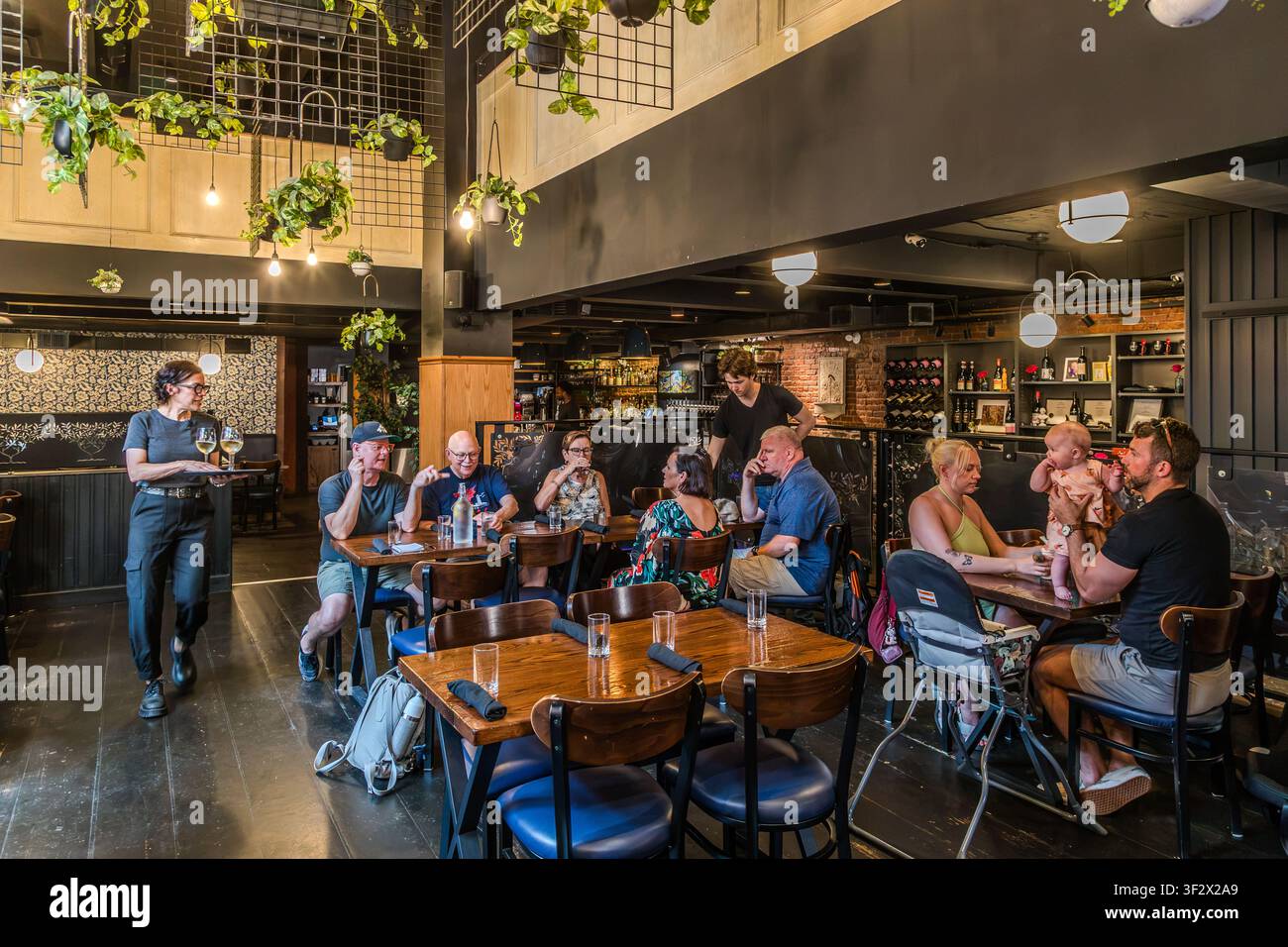 Guests are enjoying drinks at the Black Sheep restaurant. The restaurant is situated in the historic Keith’s Brewery Market building. Halifax, Nova Scotia, Canada Stock Photo