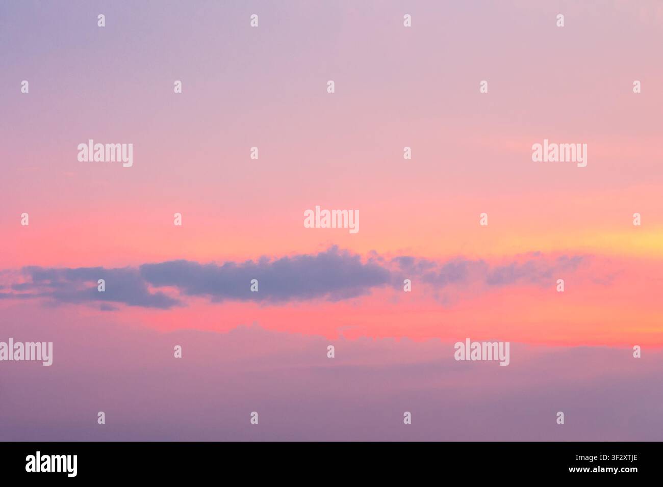 sky at sunset for background. red clouds on the blue sky. nature backdrop in evening light Stock Photo