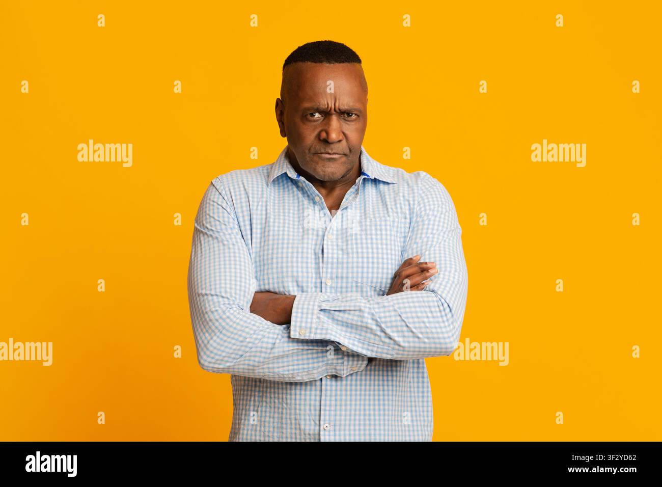 Grumpy mature african american man looking at camera Stock Photo