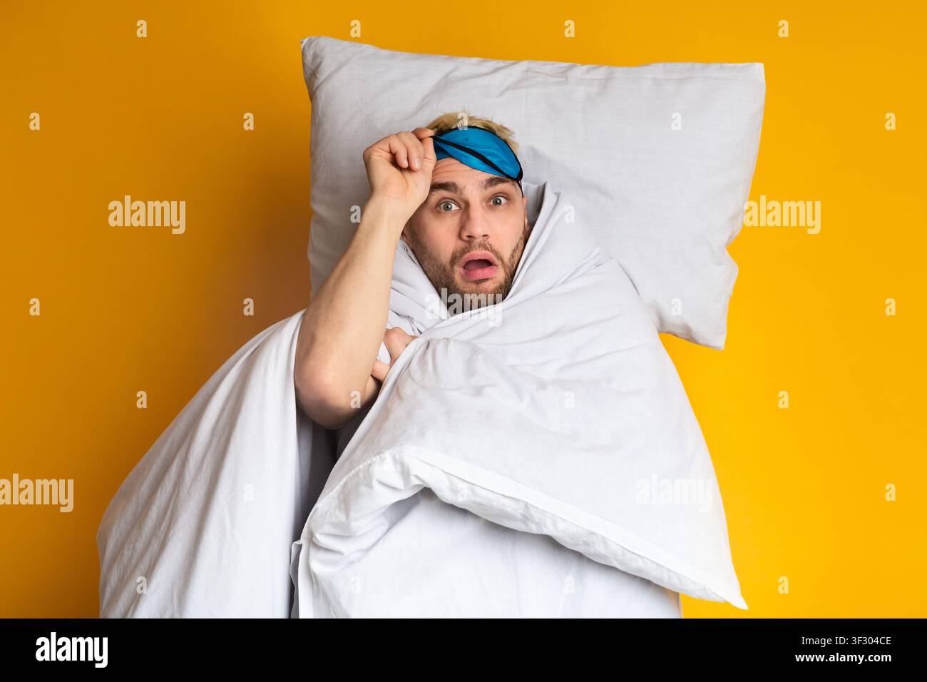 Funny guy woke up on yellow background Stock Photo