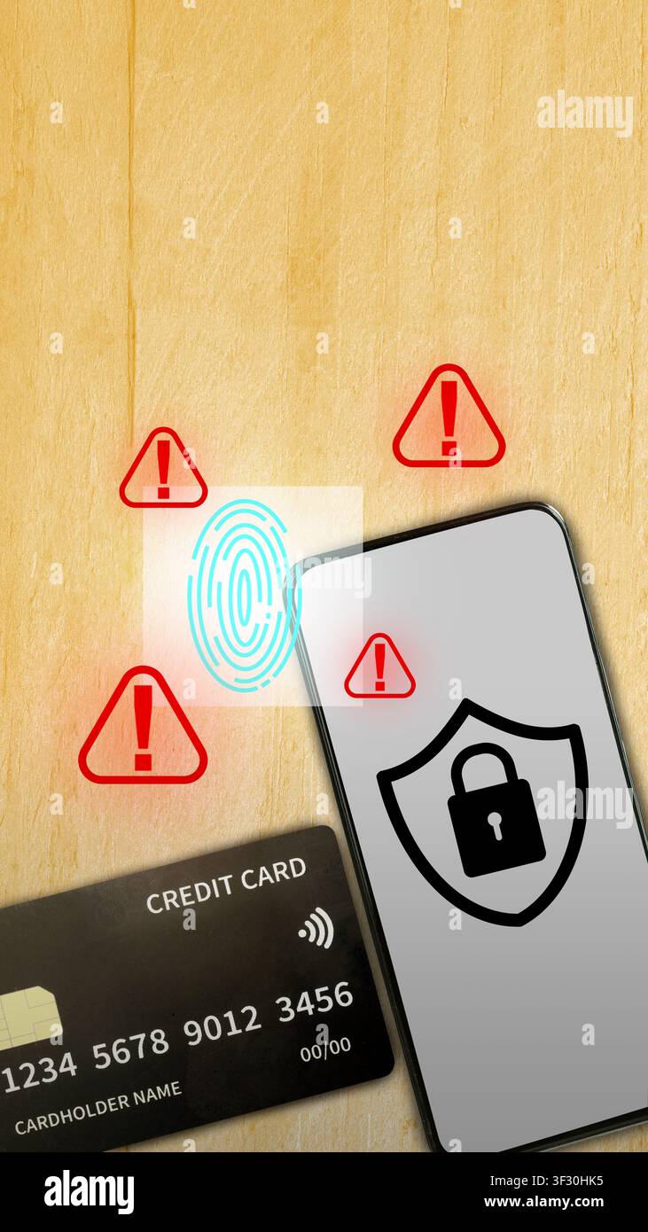 Smartphone with security shield icon, credit card, and digital fingerprint with warning alerts on wood background. Concept of mobile banking security Stock Photo