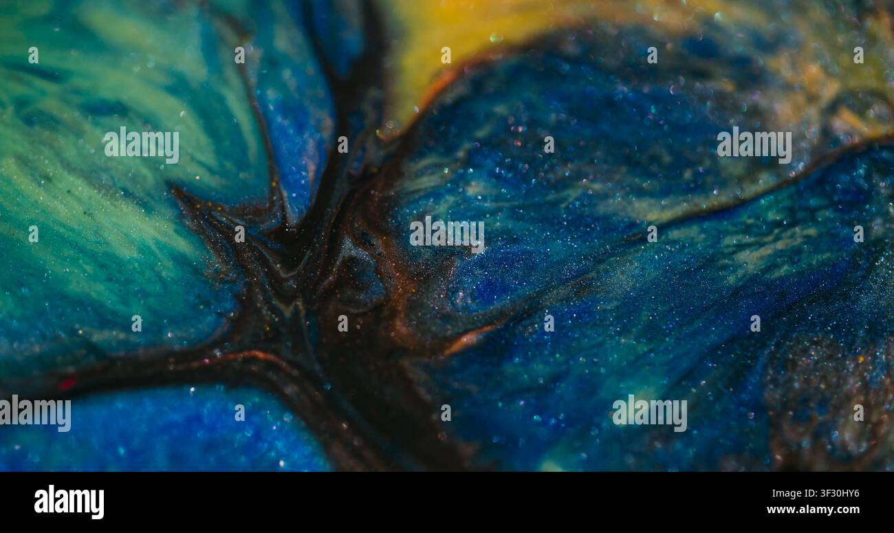 Glitter explosion defocused bokeh pigment leak ink Stock Photo