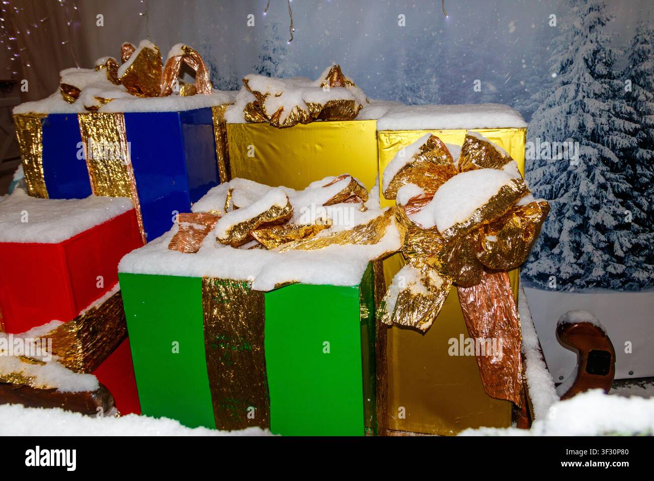 Big Christmas gift boxes covered with white snow Stock Photo