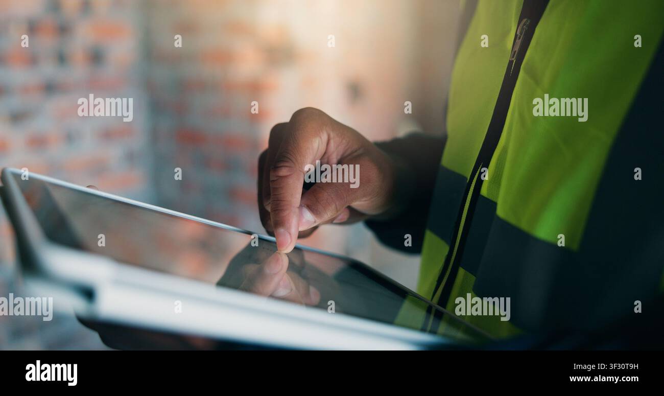 Man, tablet or hands at construction site for planning, building renovation or development. Engineer, tech or scroll at worksite for project Stock Photo