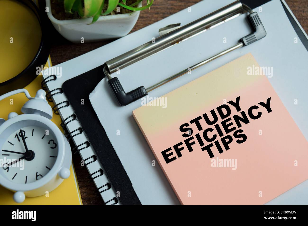 Concept of study efficiency tips write on sticky notes isolated on Wooden Table. Stock Photo