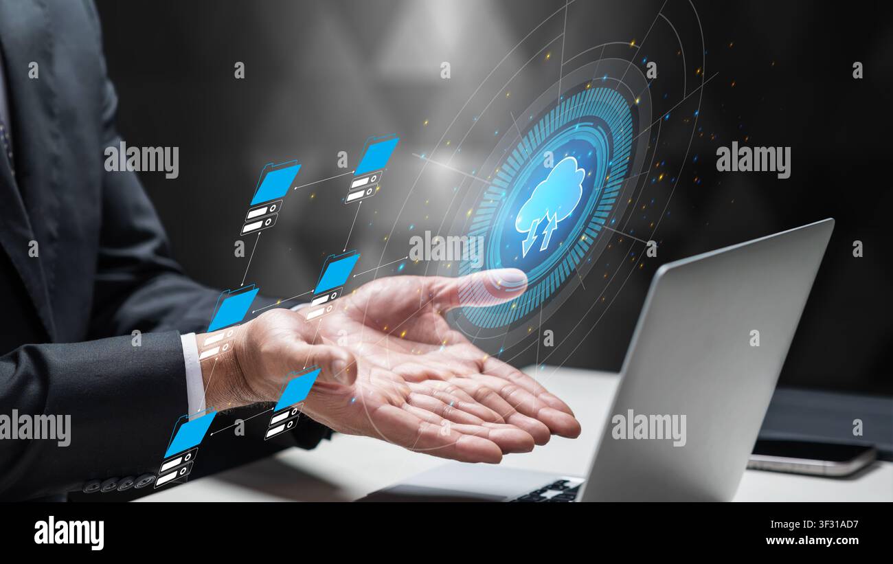 Businessman interacts with a futuristic digital cloud interface, representing data storage, networking, and IT infrastructure solutions for modern bus Stock Photo