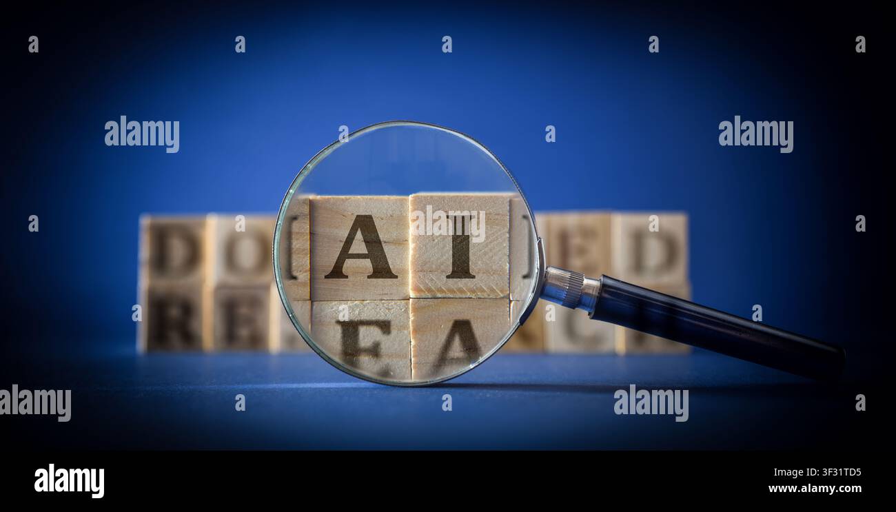 Magnifying glass highlights AI letters on wooden blocks against a blue background, symbolizing artificial intelligence, research, technology, analysis Stock Photo