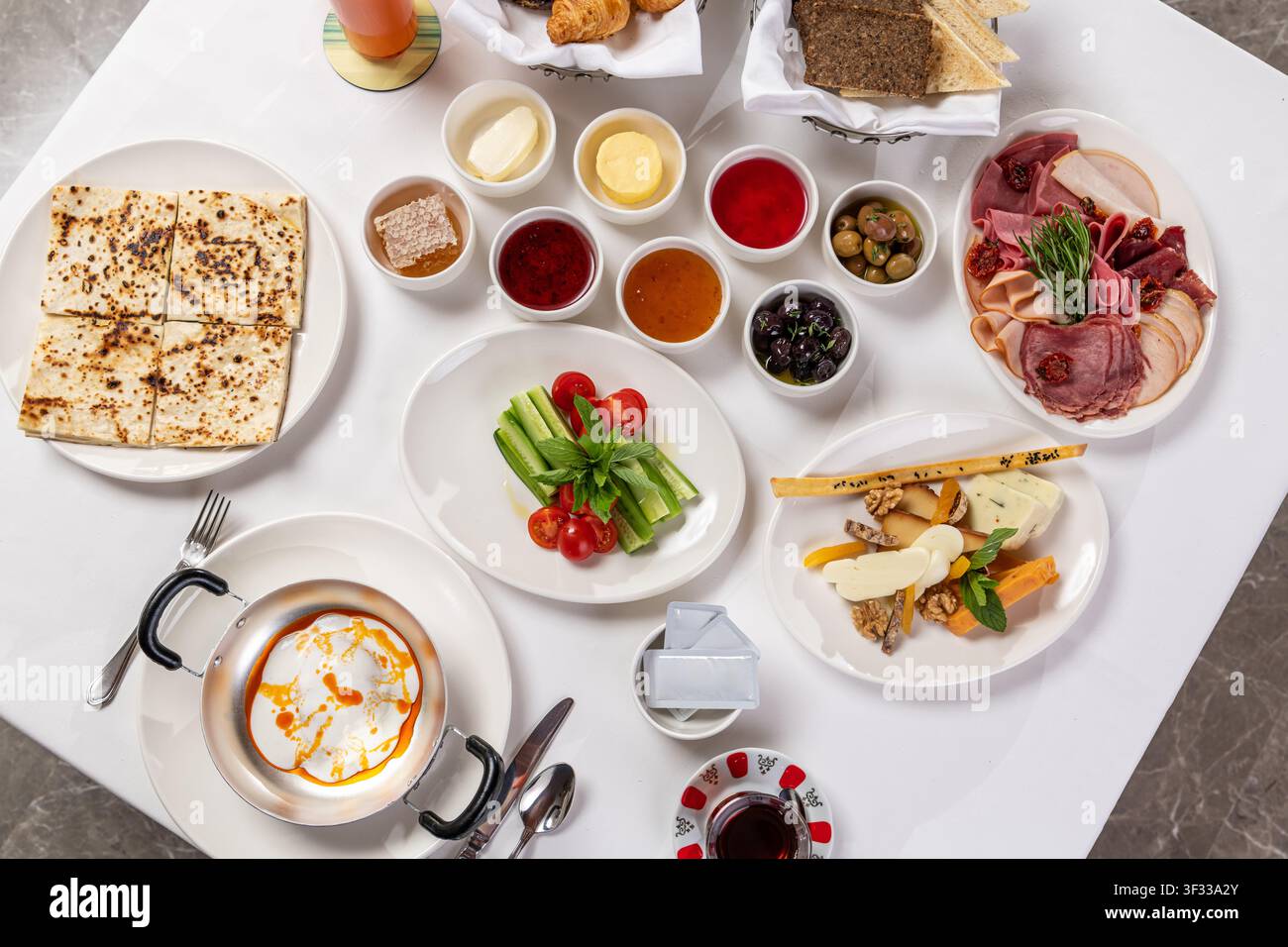 Traditional Turkish breakfast table with various dishes and tea Stock Photo