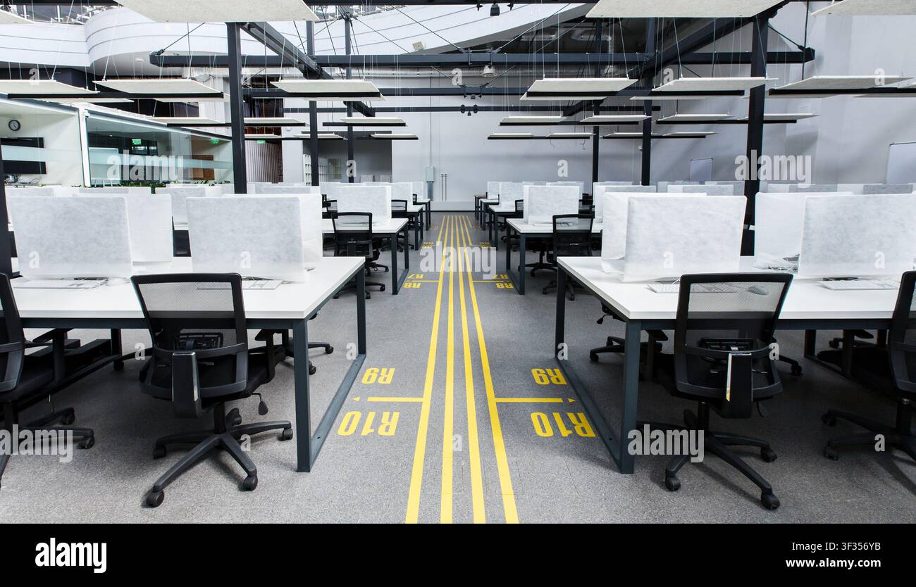 Big office with covered computers with no workers Stock Photo