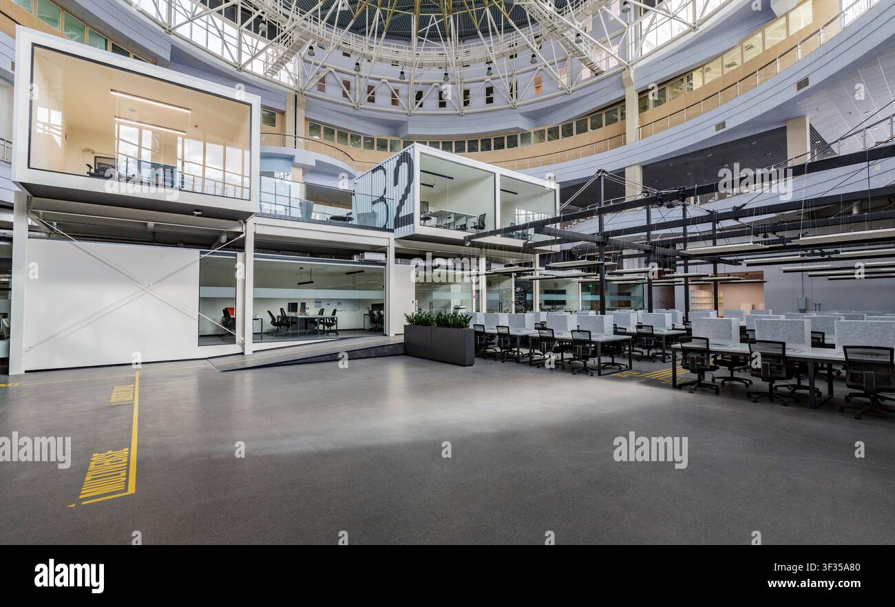 Big office with covered computers, closed due to quarantine Stock Photo