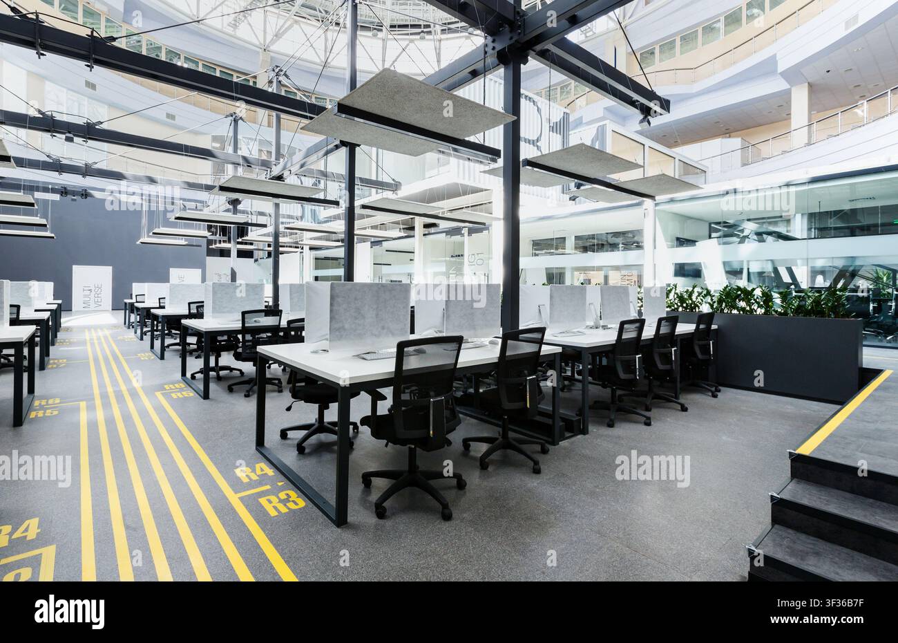 Big rental office with wrapped computers, no workers Stock Photo