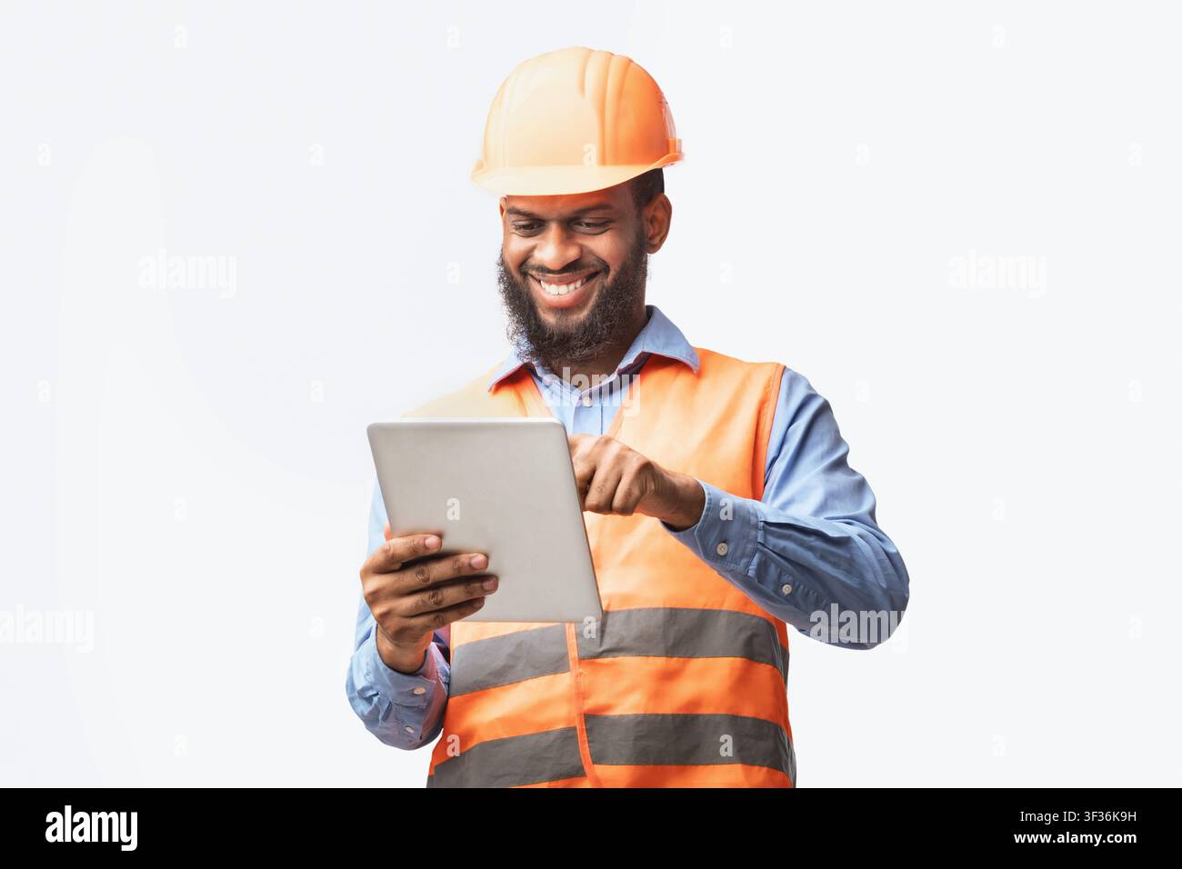 Architect Using Digital Tablet Working On Construction Site, White Background Stock Photo