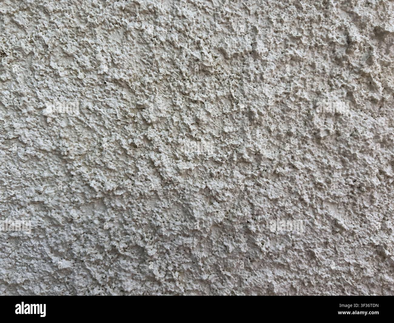 white stucco wall with rough plaster surface and minimal neutral texture background Stock Photo