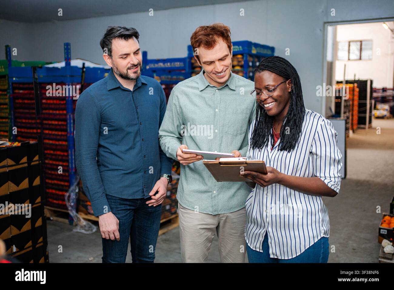 Diverse team checking inventory in food warehouse Stock Photo