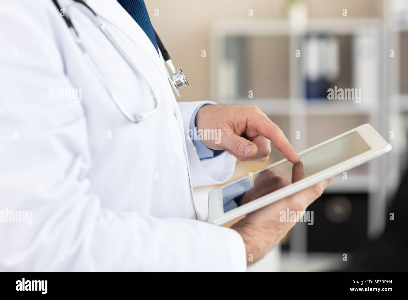 Side view of medical practitioner using digital tablet Stock Photo