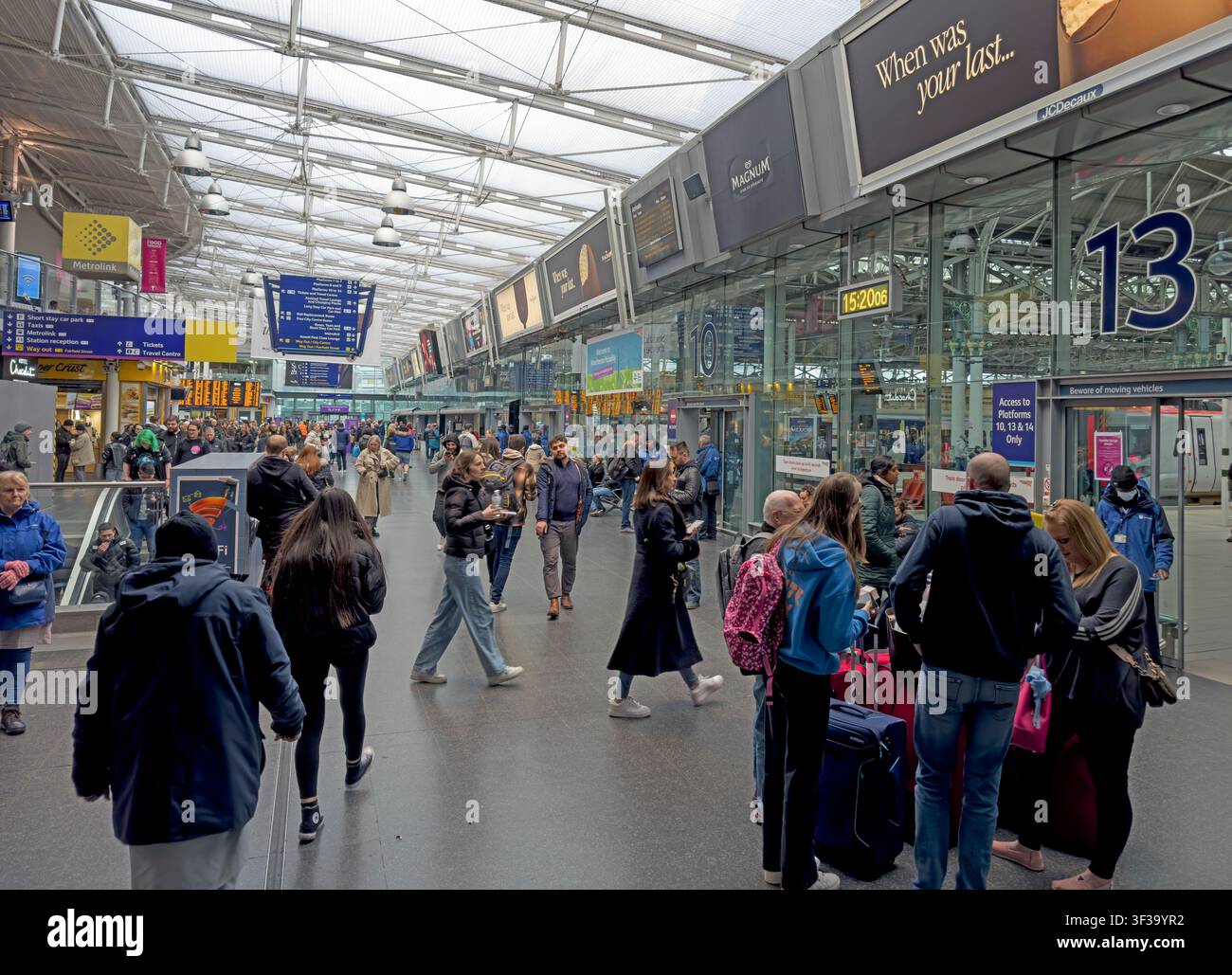 Busy Manchester Piccadilly railway station concourse with passengers and luggage during a weekday afternoon in Manchester, England, UK Stock Photo