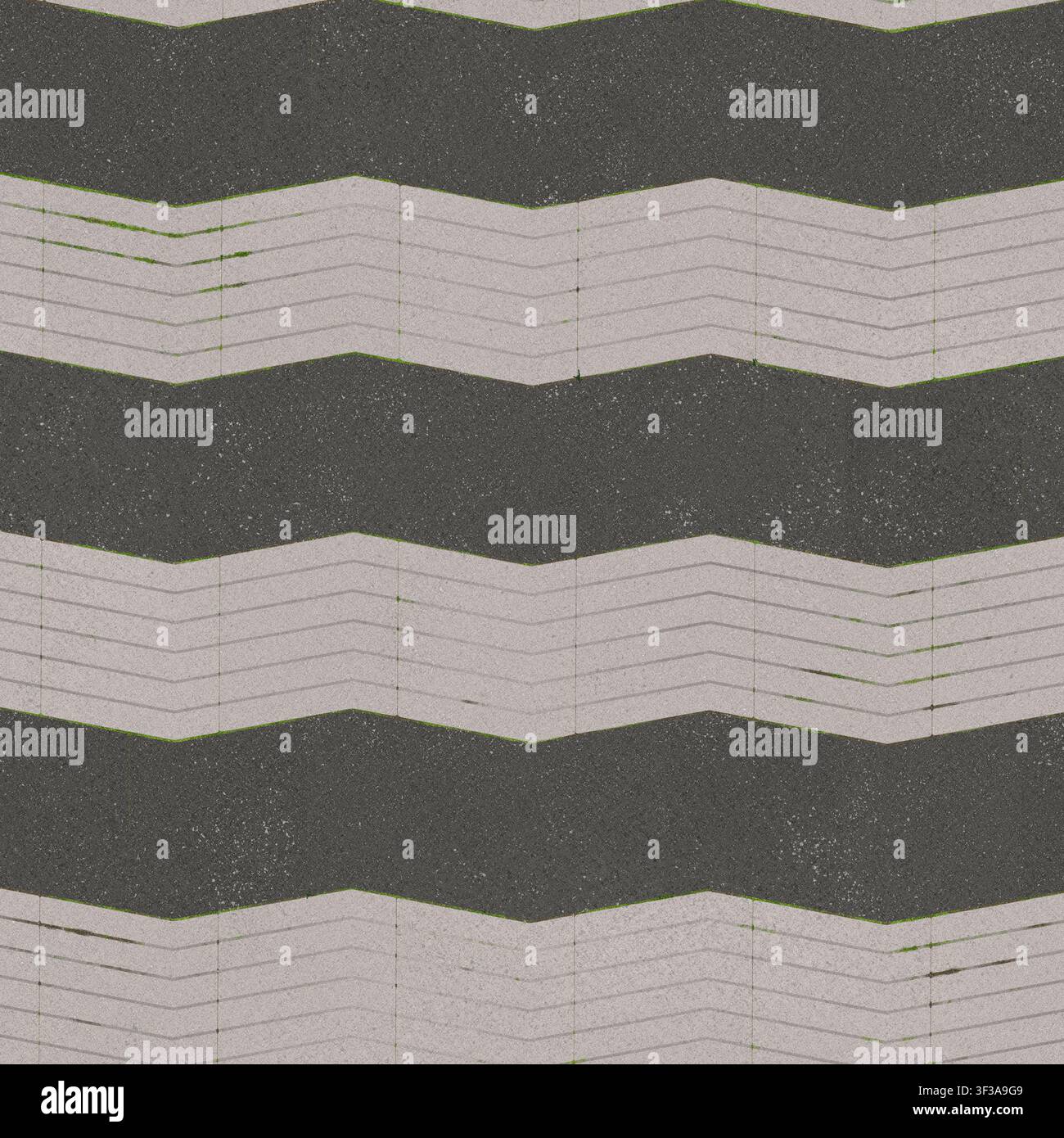 A high resolution seamless background texture featuring dark grey and light grey chevron paving blocks. Stock Photo