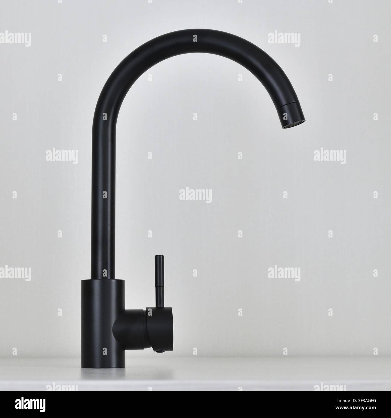Black single-lever mixer tap on light background Stock Photo