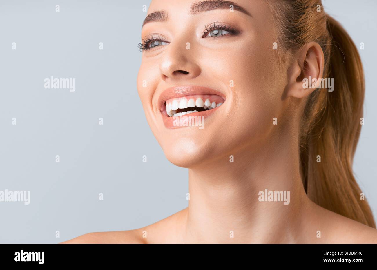 Close Up Portrait of a Young Woman Smiling Stock Photo