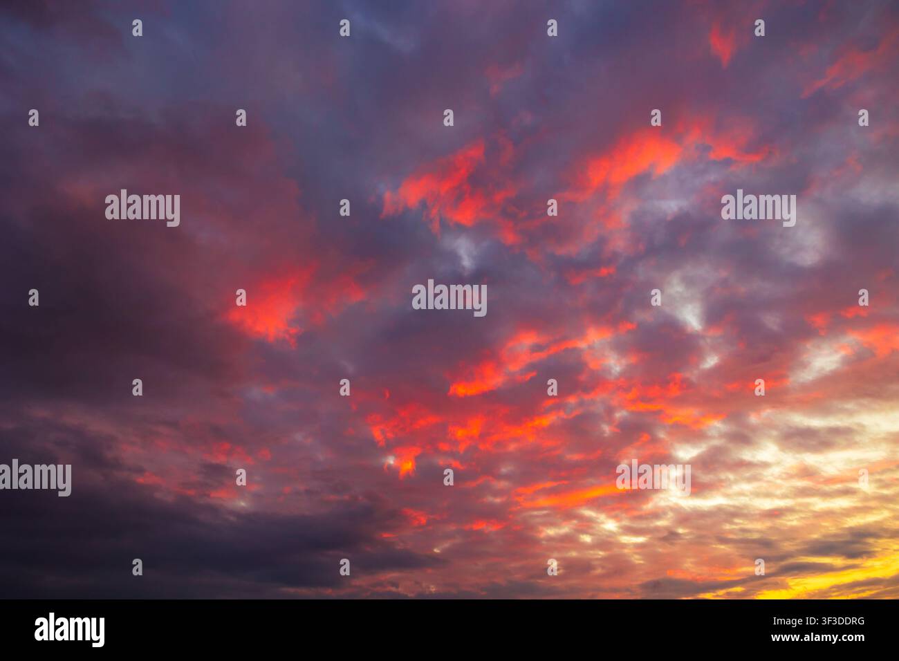 Partly cloudy sunset sky. Dramatic orange sky background photo Stock Photo
