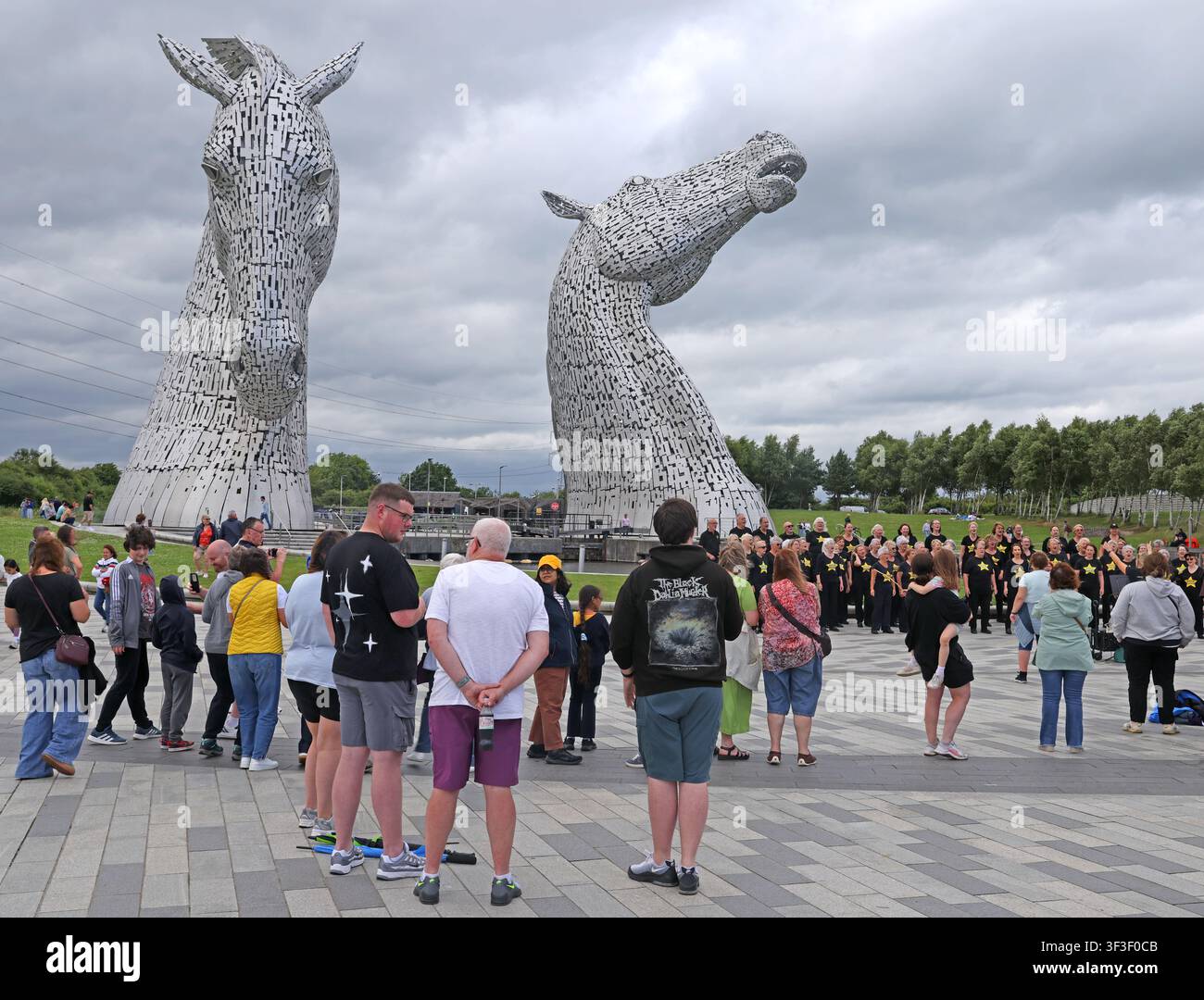 Crowds sightseeing beside Andy Scott’s monumental Clydesdale-inspired Kelpies at the popular Helix visitor park in Falkirk., FK2 7ZT Stock Photo