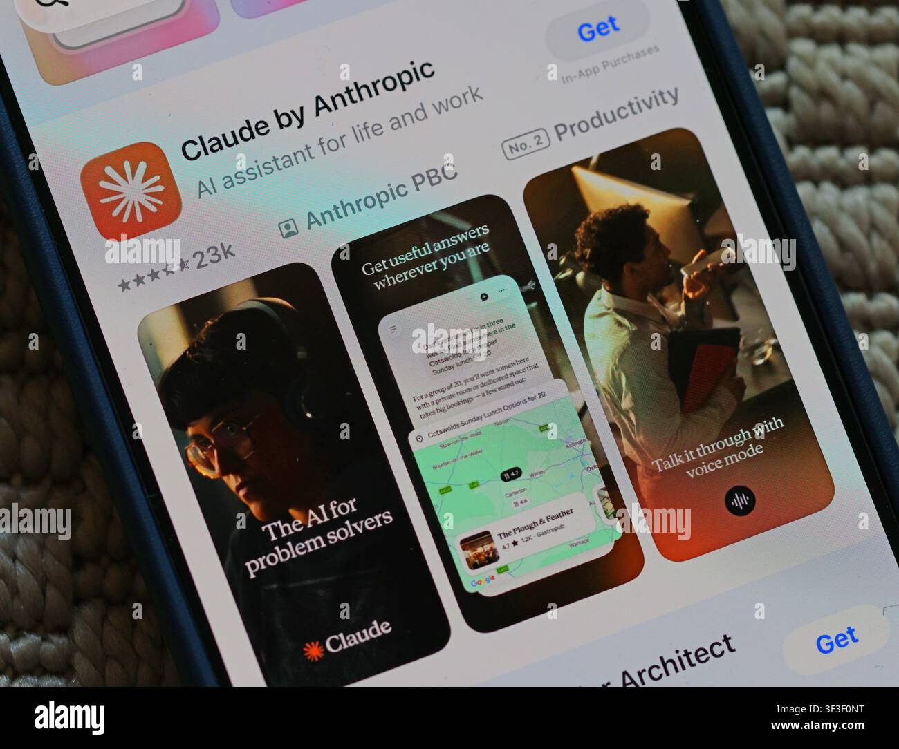 Close-up of the Claude by Anthropic download page on smartphone, highlighting chatbot hallucinations, false reassurance and human-like AI conversation Stock Photo