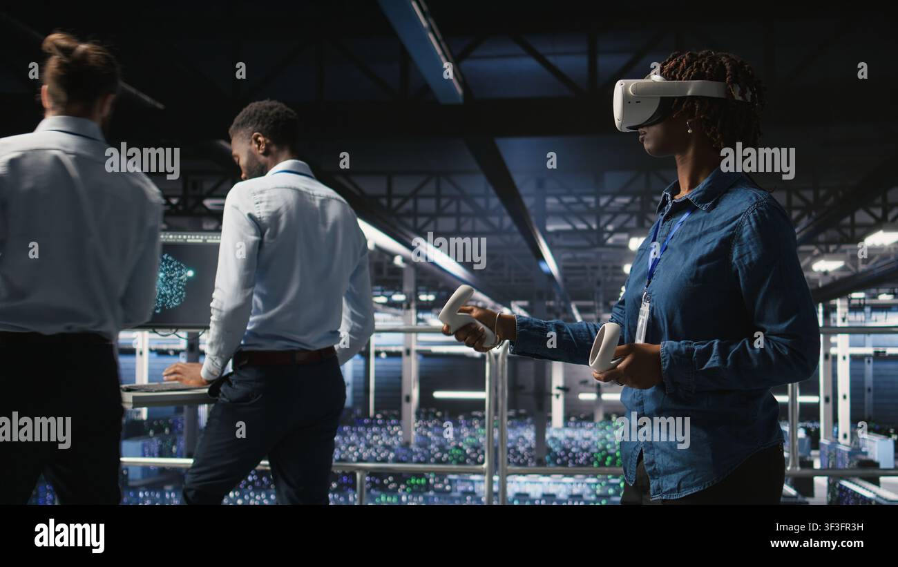 Data center admin wearing VR headset using artificial intelligence neural networks technology. Server hub developer using AI programming language and virtual reality to update hardware, Stock Photo