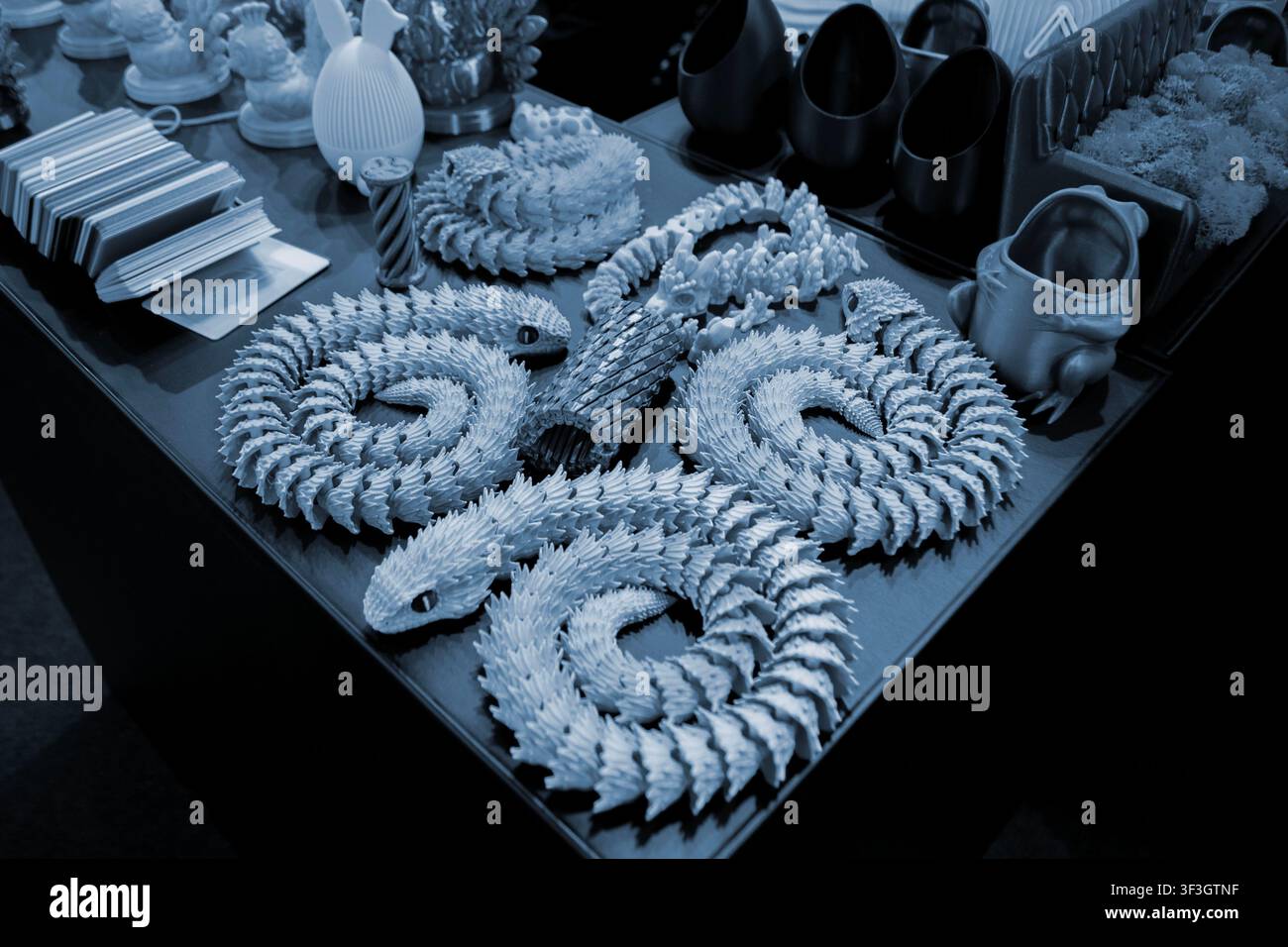 Art models printed on 3D printer. Different objects created on 3D printer from molten plastic. 3D printed different objects. Modern new modern additive progressive technologies. 3D printing technology Stock Photo