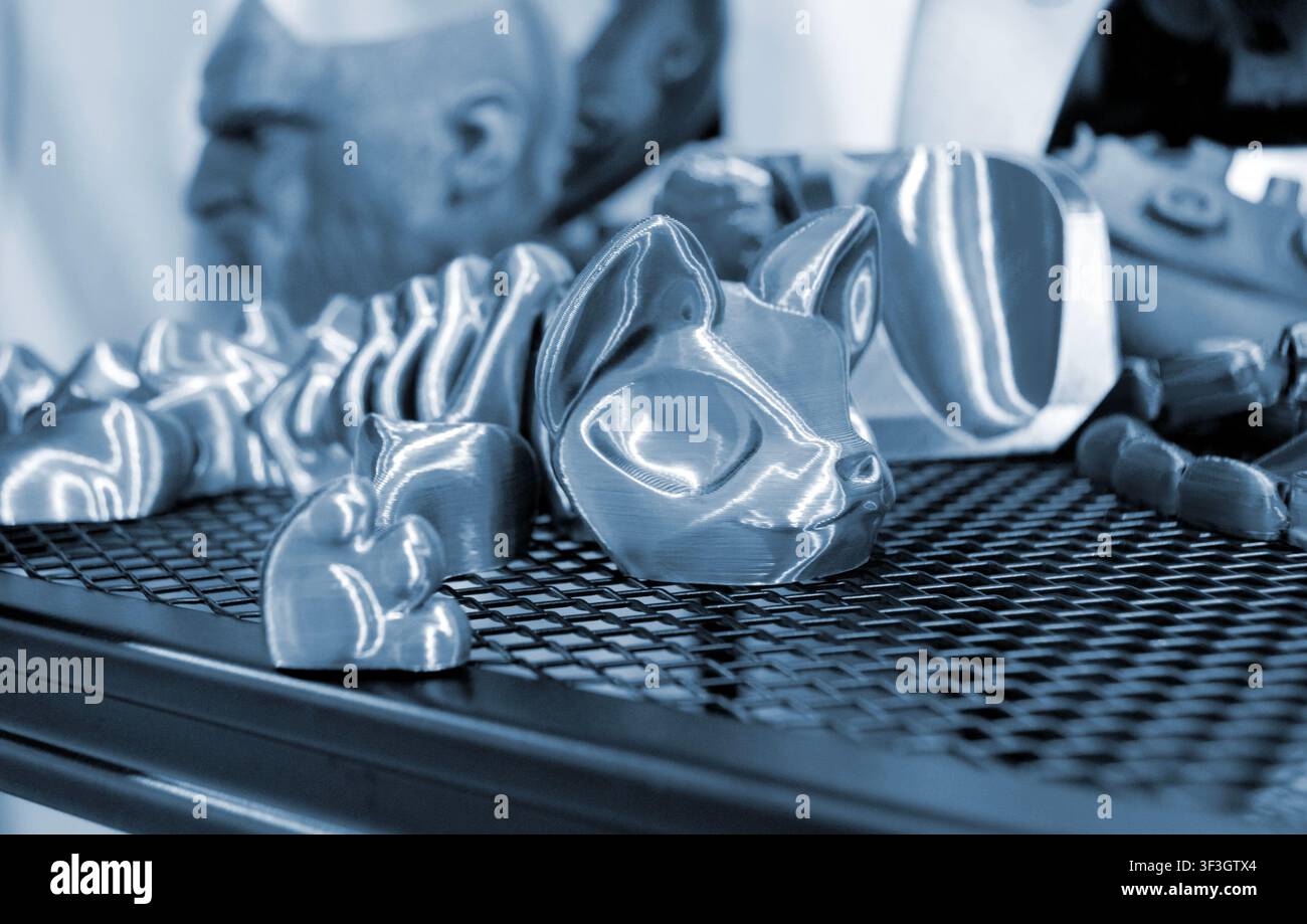 Art models printed on 3D printer. Different objects created on 3D printer from molten plastic. 3D printed different objects. Modern new modern additive progressive technologies. 3D printing technology Stock Photo