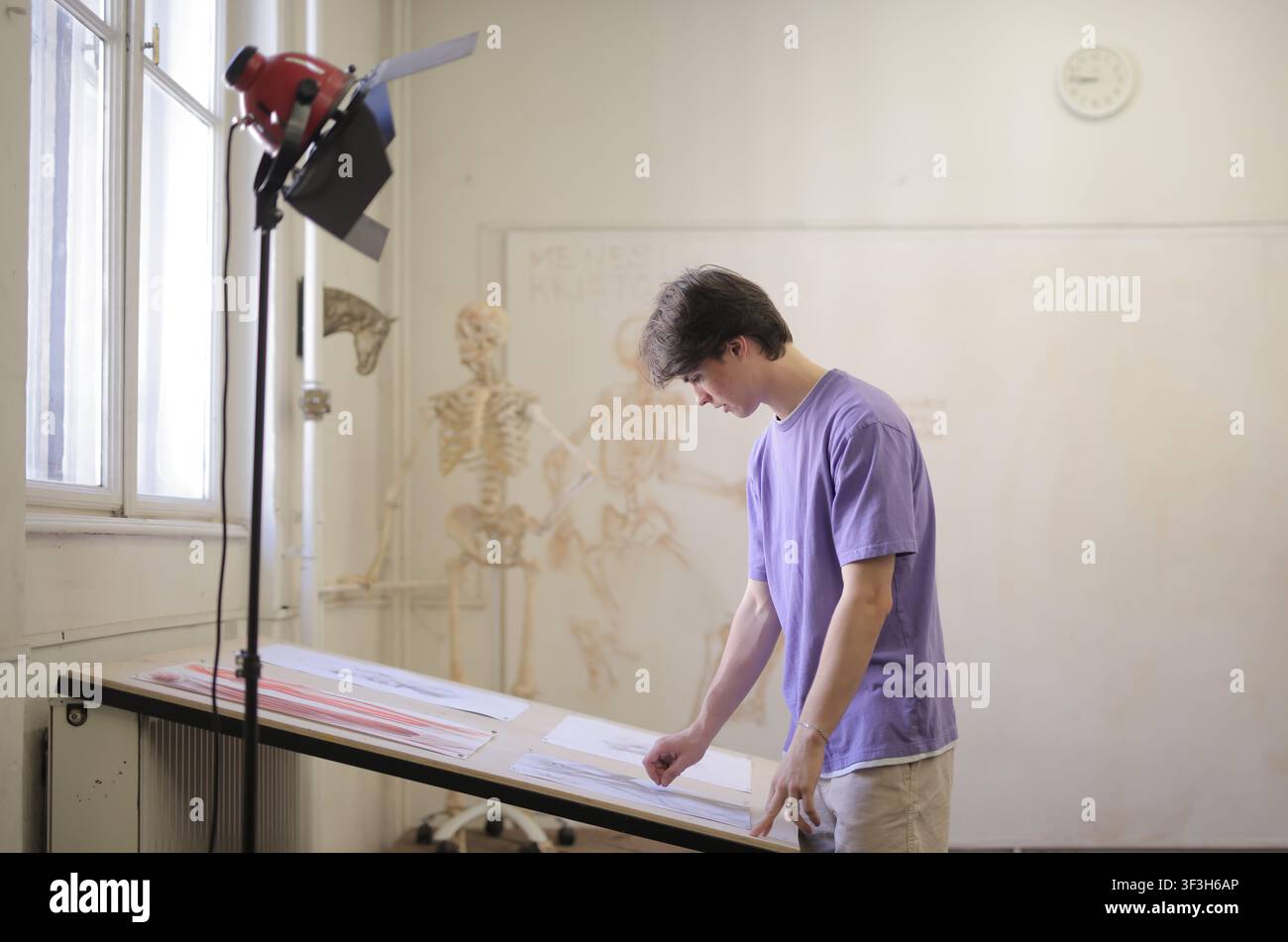 Young art student working in a studio classroom Stock Photo