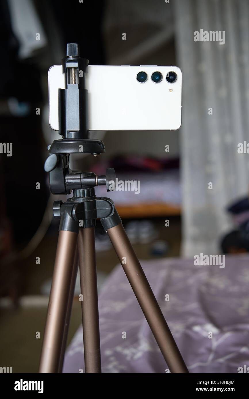 smartphone mounted on a mobile tripod Stock Photo