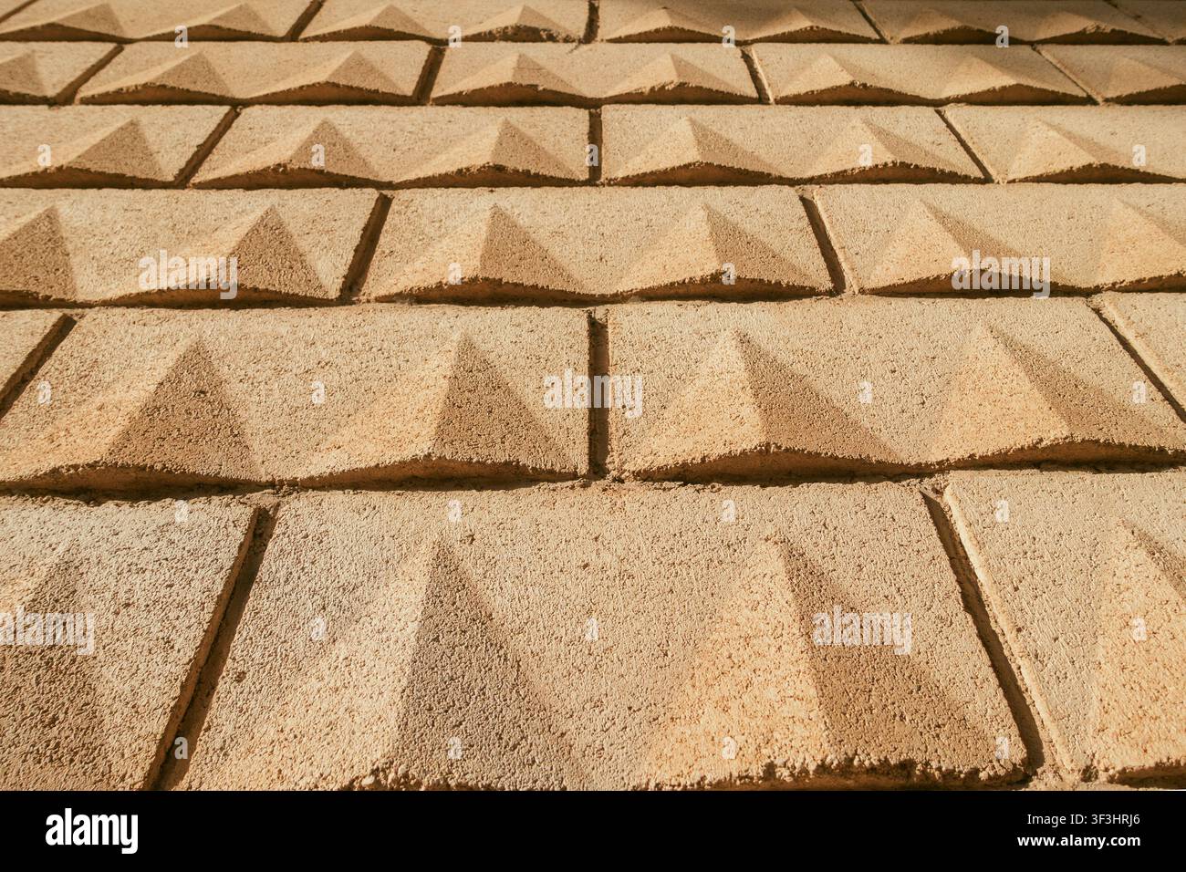 Concrete Yellow Sand-Colored Block Wall Texture Background Stock Photo