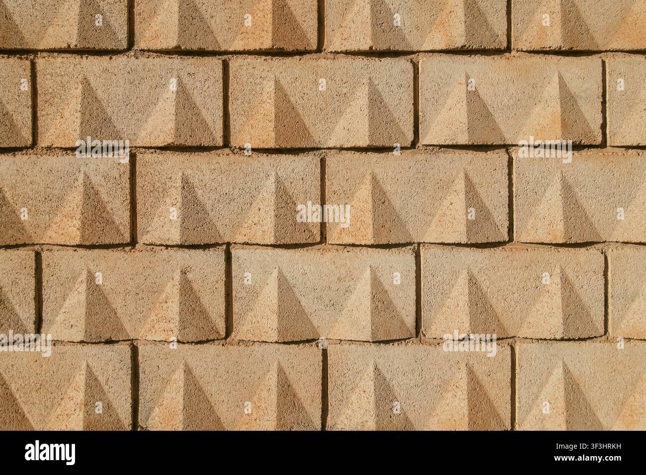 Concrete Yellow Sand-Colored Block Wall Texture Background Stock Photo